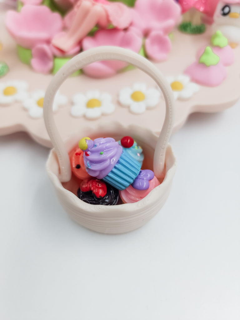 fairy garden basket with cupcakes