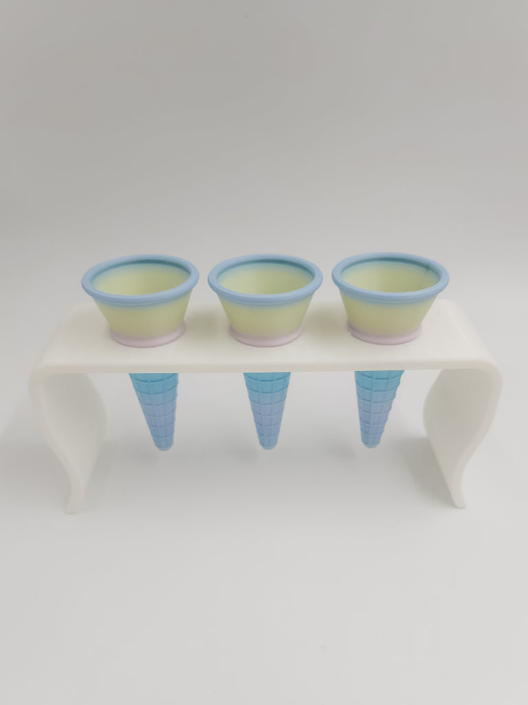ice cream cones sitting on playstand 